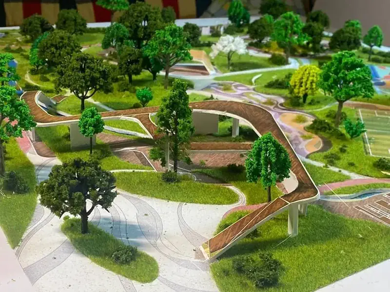 Maquete arquitetônica de paisagismo urbano com grama para maquete e árvores aplicadas em escala